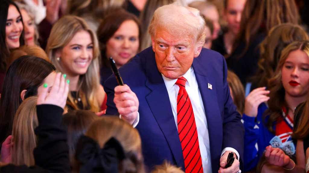 Trump w pen 16z9 EDITORIAL ONLY