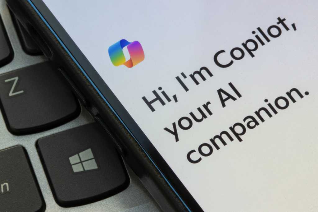 Portland, OR, USA - Nov 4, 2024: Microsoft Copilot apps landing page is seen on an iPhone. Microsoft Copilot is a generative artificial intelligence chatbot developed by Microsoft.